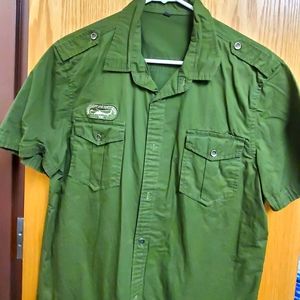Green button up shirt with patch